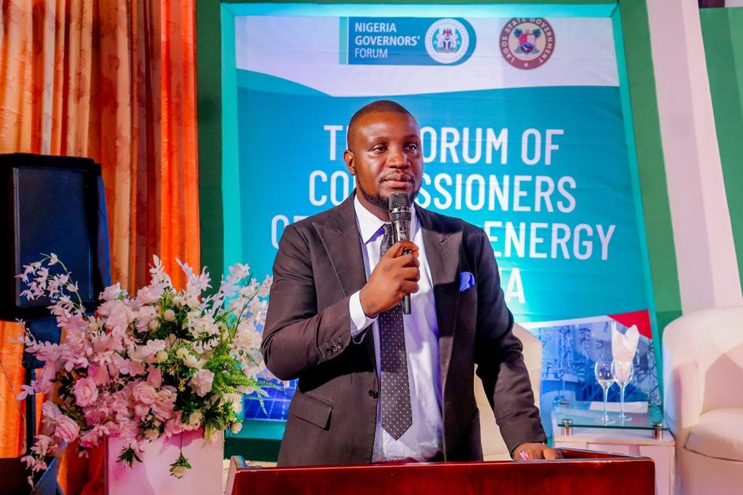 Abayomi moderating a conference